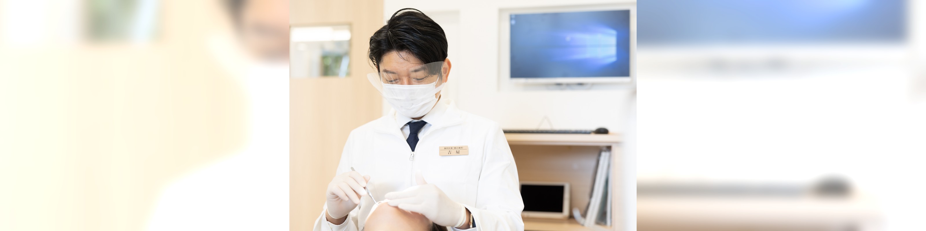 矯正治療について説明する駒沢よしや矯正歯科の院長